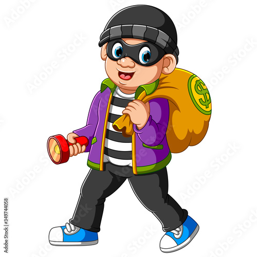 Thief man with flashlight in his hand