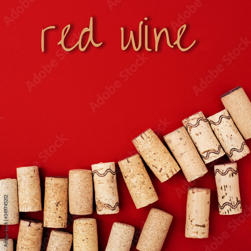 Wooden wine corks on paper background with copy space and text 