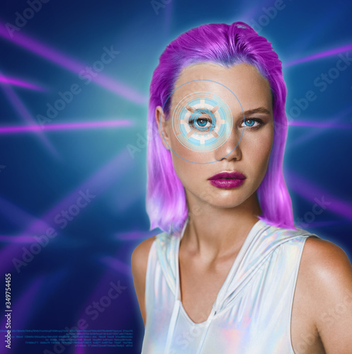 Portrait of a beautiful young woman in futuristic style against the background of ultraviolet lines.