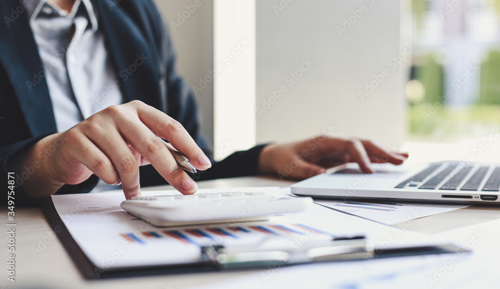 Accounting businessmen are calculating income-expenditure and analyzing real estate investment data, Dedicated to the progress and growth of the company, Financial and tax systems concept. Accounting businessmen are calculating income-expenditure and analyzing real estate investment data, Dedicated to the progress and growth of the company, Financial and tax systems concept.