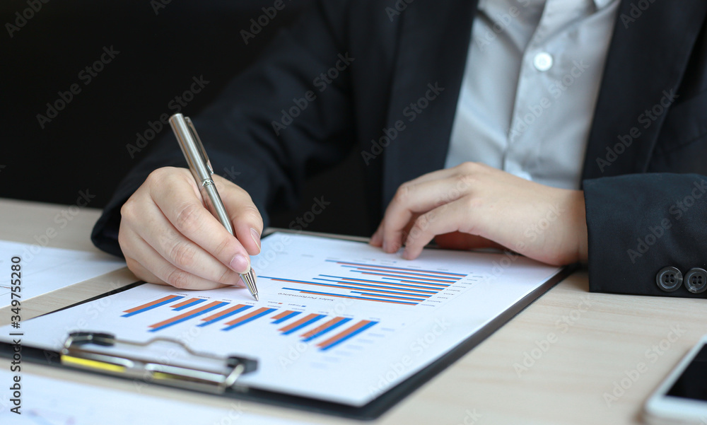 Financial businessmen analyze the graph of the company's performance to create profits and growth, Market research reports and income statistics, Financial and Accounting concept. Financial businessmen analyze the graph of the company's performance to create profits and growth, Market research reports and income statistics, Financial and Accounting concept.