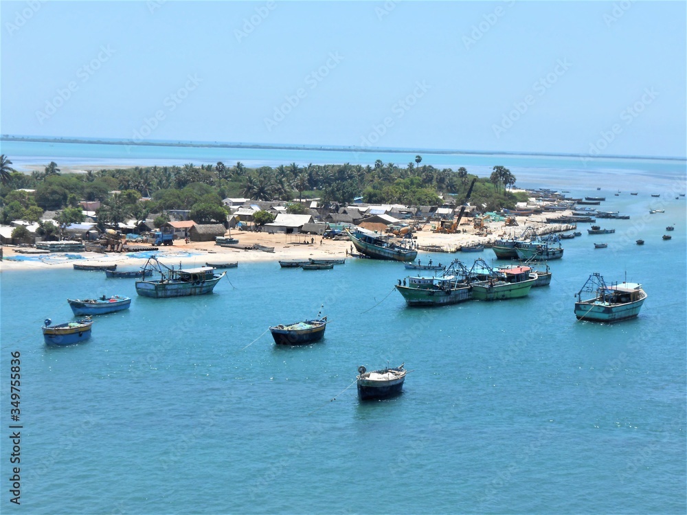 fishing boats in the harbor. Drone Shot taken over the small island of Rameswaram. Boats and harbours of fishing. Vast blue ocean. Simple living of inhabitants of island. Slow life. Aerial photography