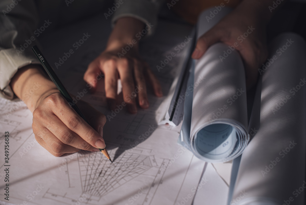 Architect working on blueprint. Architects workplace - architectural ...
