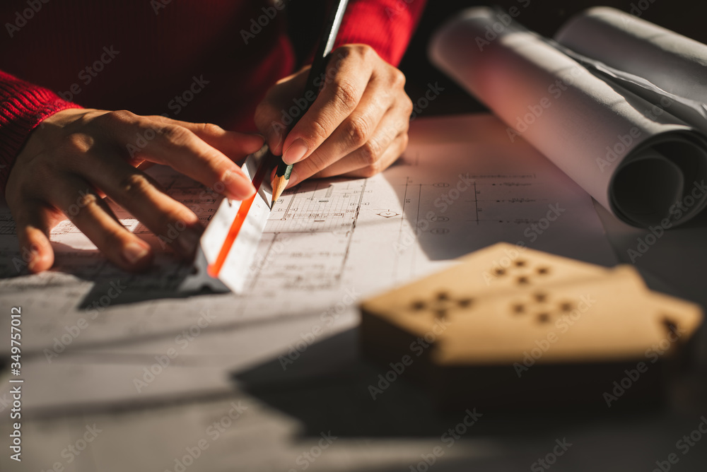 Architect working on blueprint. Architects workplace - architectural ...