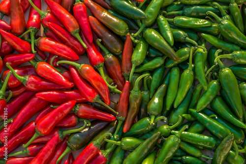 Large crop of red and green hot chili peppers