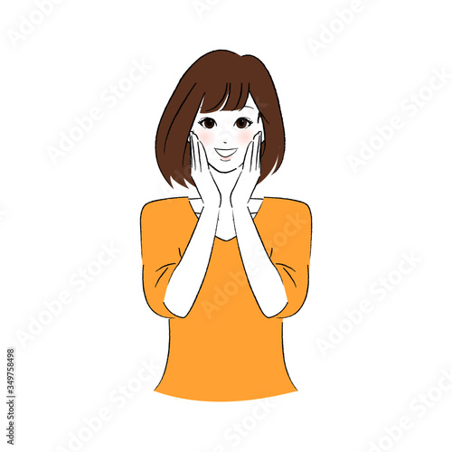 頬に両手を添える女性