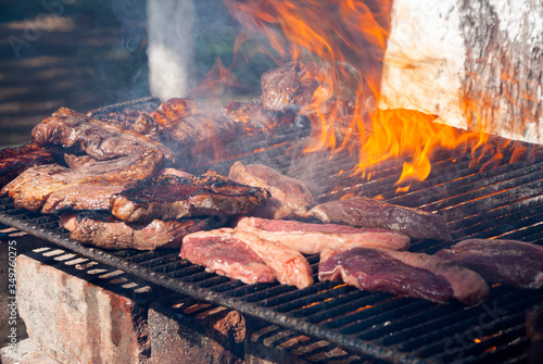 Grilled chorizo ​​sausages outdoors, celebrating plenty of protein meat and nutrition.