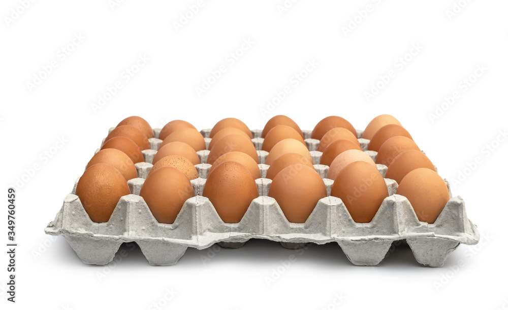Eggs in the cardboard egg tray on white. Eggs in the cardboard egg tray on white.