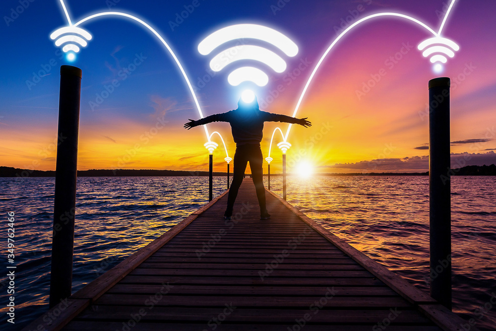Obraz premium happy and relax woman, female, on wood bridge over sea with phone signal technology with network connection concept of happy nature life