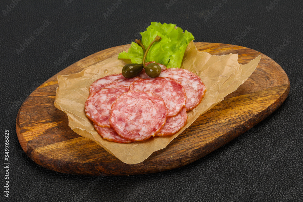 Spanish Salchichon sausage with salad Spanish Salchichon sausage with salad