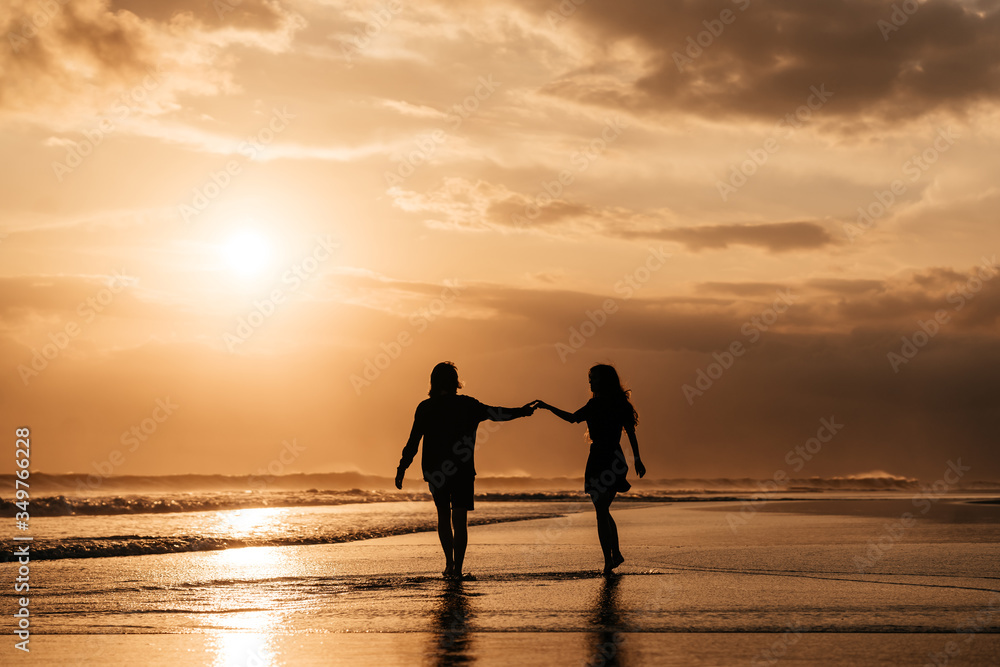 Young couple in love, Attractive man and woman enjoying romantic evening on sunset