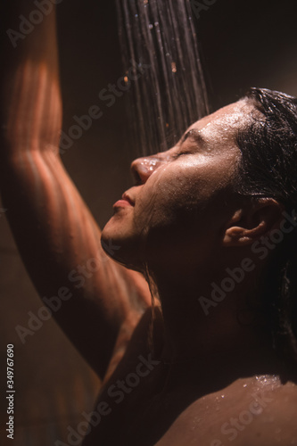 young pretty woman taking shower