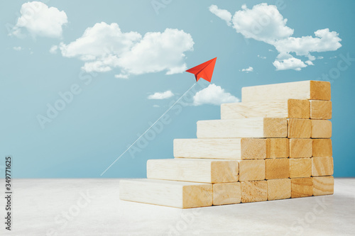Billede på lærred Arranging wood cube block stacking as step stair for Business concept of ladder career path and growth success process