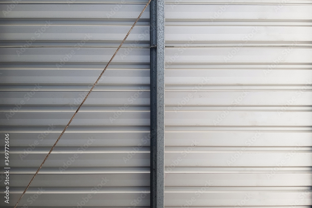 Metal roof in the parking lot of the mall. Gray background. Metal roof in the parking lot of the mall. Gray background.