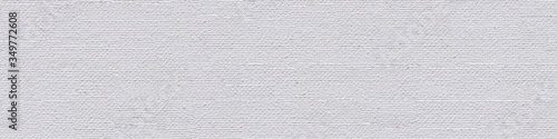 Perfect linen canvas background in gentle light color as part of your decor work. Seamless panoramic texture.