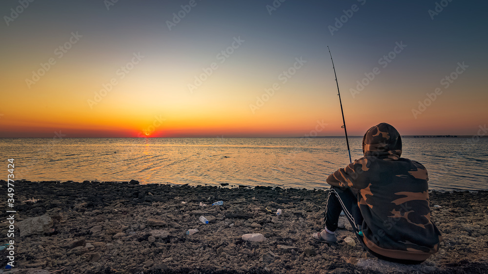 Man fishing silhoutte in uqair port area -Saudi Arabia