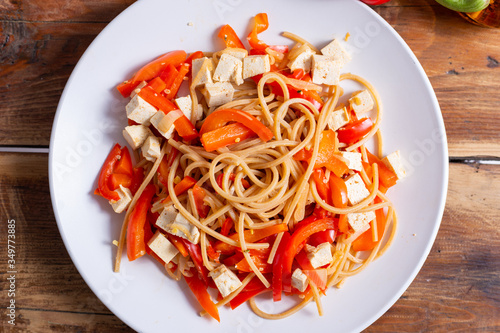 Vegan food; pasta with tofu and red peppers