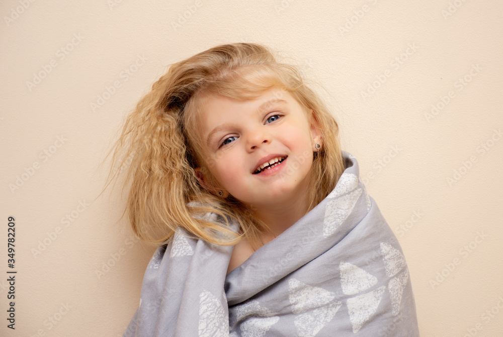 smiling blonde child girl with blue eyes. Joyful emotions of a four year old child. smiling blonde child girl with blue eyes. Joyful emotions of a four year old child.