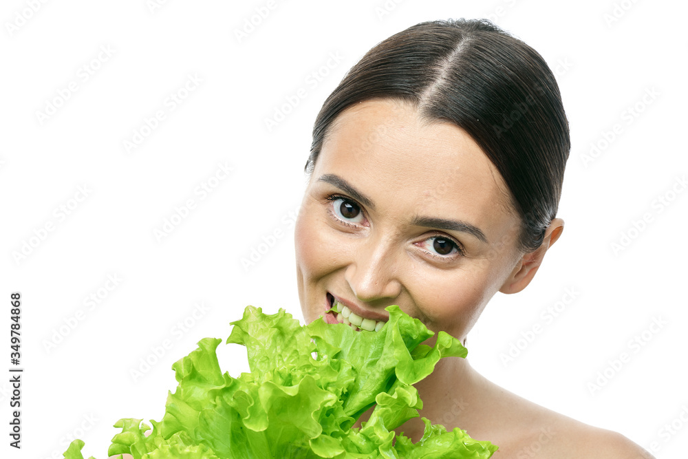 portrait of a girl with clean skin without makeup with a leaf of green salad portrait of a girl with clean skin without makeup with a leaf of green salad