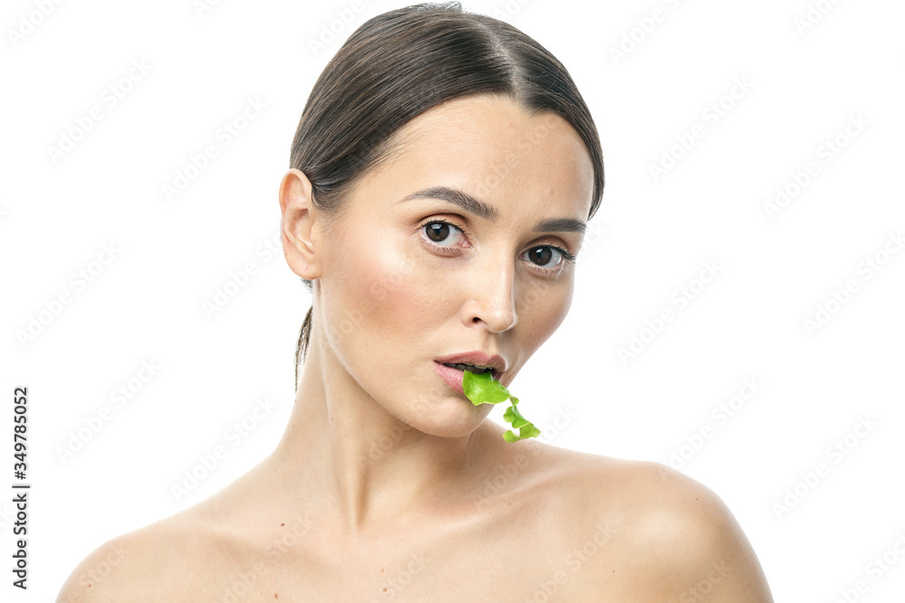 portrait of a girl with clean skin without makeup with a leaf of green salad portrait of a girl with clean skin without makeup with a leaf of green salad