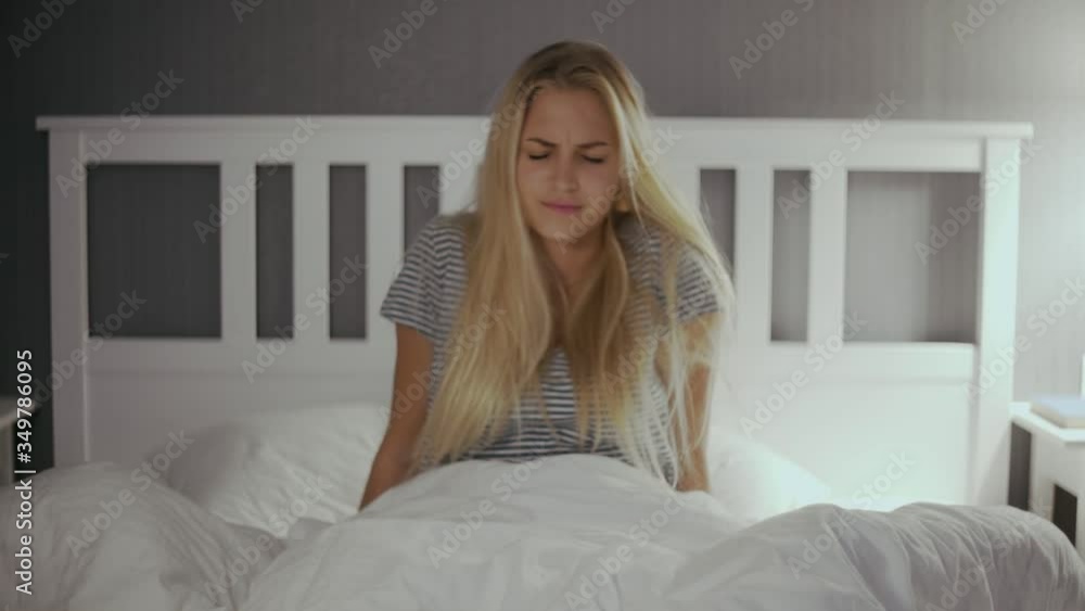 Young beautiful woman waking up early and feeling tired Young beautiful woman waking up early and feeling tired