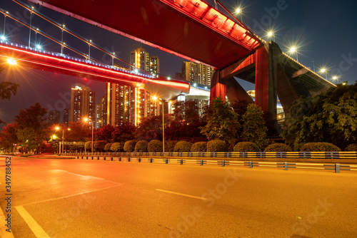 Red suspension bridges and highways at night