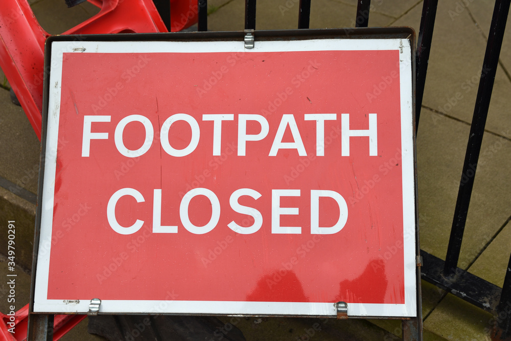 Red and white footpath closed sign with blurred background in Scotland, UK Red and white footpath closed sign with blurred background in Scotland, UK