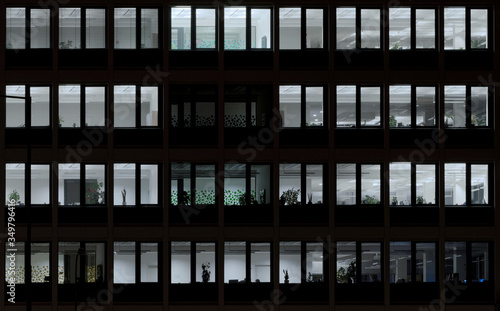 Open offices windows in the night with lights, Slovakia