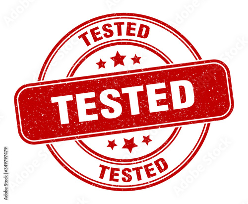 tested stamp. tested label. round grunge sign