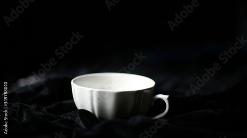 White colour soup cup in dark background