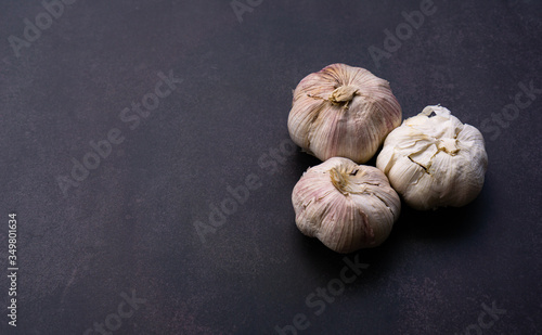 Fresh Garlic on black wall background, 45-degree view