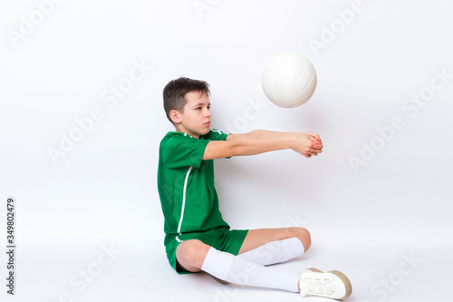 Kid play with volleyball over white background. Kid activities.Training game concept.