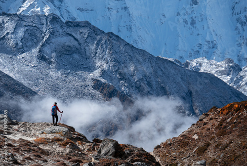 Active hiker in travel to Everest enjoying the valley view in Himalaya mountains landscape