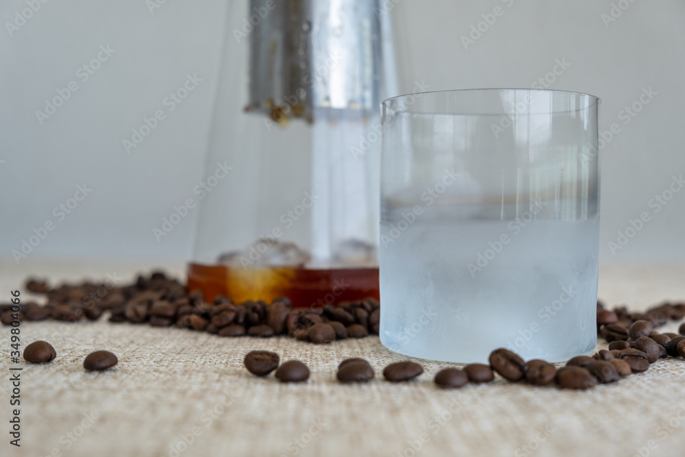 Cold brew coffee, coffee droplets behind a ice cold glass. Cold brew coffee, coffee droplets behind a ice cold glass.