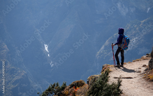 Active hiker in travel to Everest enjoying the valley view in Himalaya mountains landscape