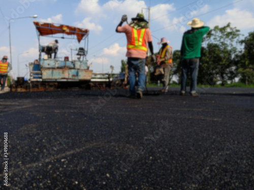 Picture blurred asphalt road construction By using heavy machinery