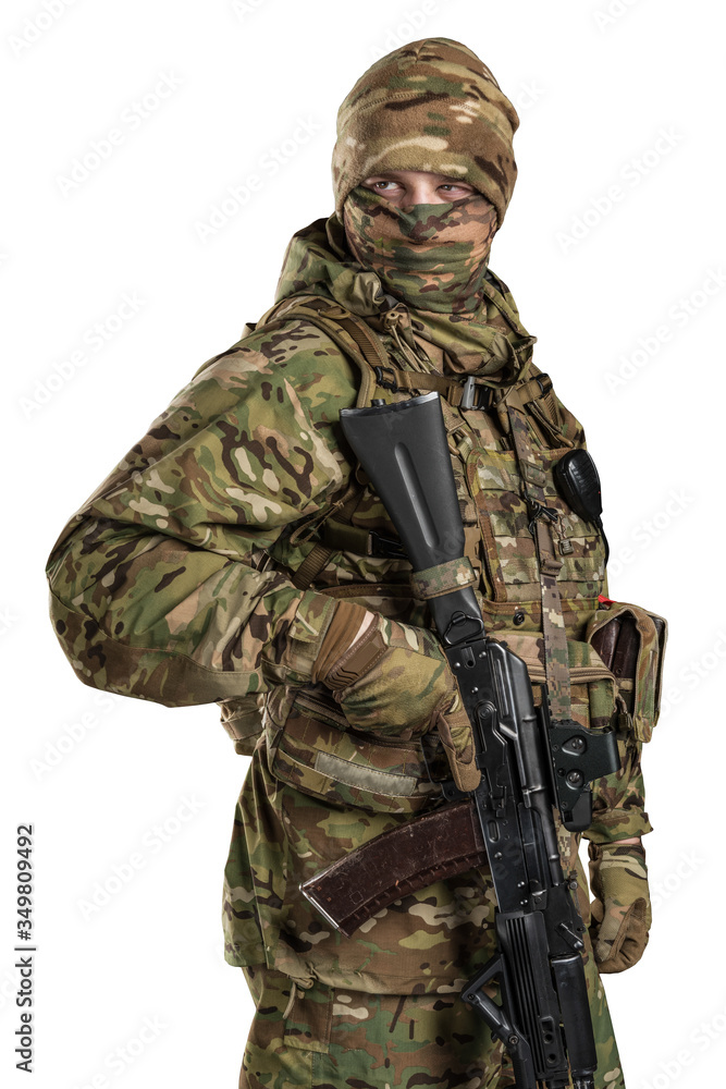 One soldier holding assault rifle. Uniform conforms to sub-unit of Russia's special forces Alpha Group FSB. Shot in studio. Isolated with clipping path on white background One soldier holding assault rifle. Uniform conforms to sub-unit of Russia's special forces Alpha Group FSB. Shot in studio. Isolated with clipping path on white background