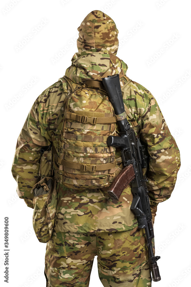 One soldier holding assault rifle. Uniform conforms to sub-unit of Russia's special forces Alpha Group FSB. Shot in studio. Isolated with clipping path on white background One soldier holding assault rifle. Uniform conforms to sub-unit of Russia's special forces Alpha Group FSB. Shot in studio. Isolated with clipping path on white background