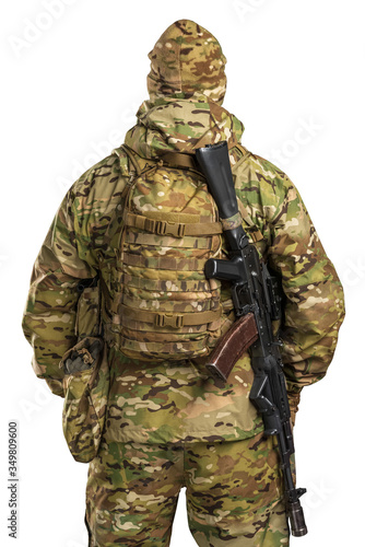 One soldier holding assault rifle. Uniform conforms to sub-unit of Russia's special forces Alpha Group FSB. Shot in studio. Isolated with clipping path on white background