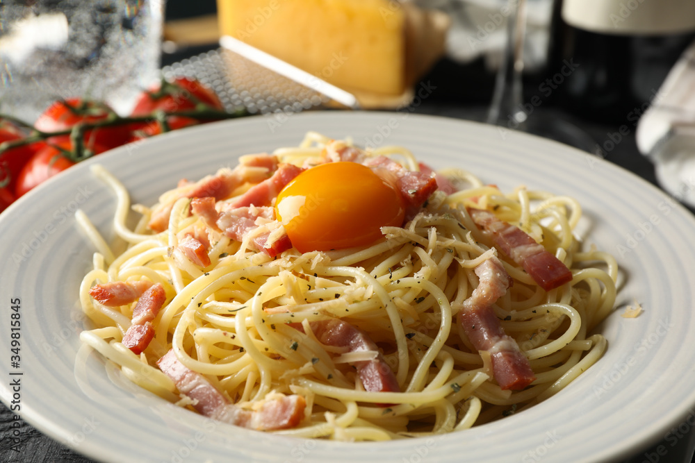 Composition with plate of tasty pasta on wooden background, close up Composition with plate of tasty pasta on wooden background, close up