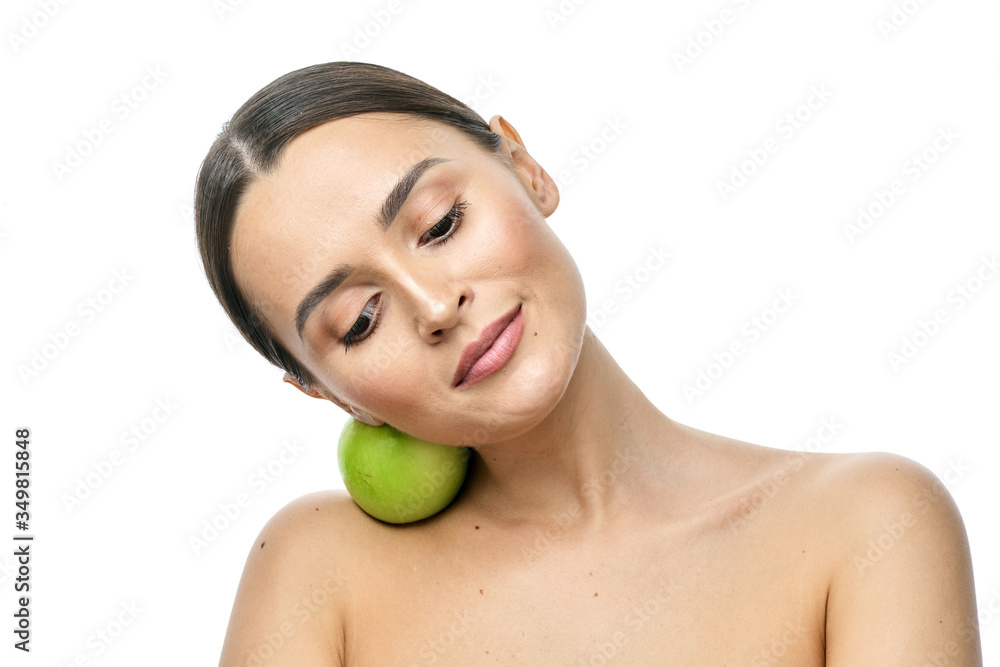 close-up portrait of a girl with clear skin holding a apple to her face, isolated on a white background close-up portrait of a girl with clear skin holding a apple to her face, isolated on a white background