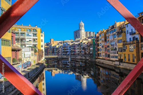 View of the Onyar river from the iron bridge in Girona