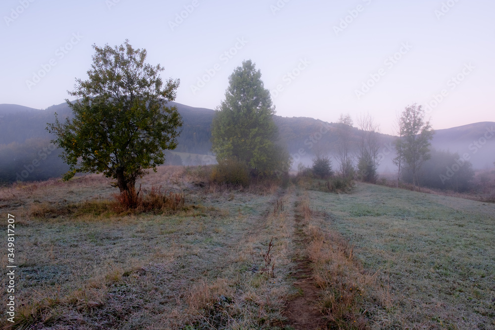 Beautiful autumn rural landscape with mountain and trees over amazing colors sky. Beautiful autumn rural landscape with mountain and trees over amazing colors sky.