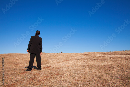 Businessman looking at the field