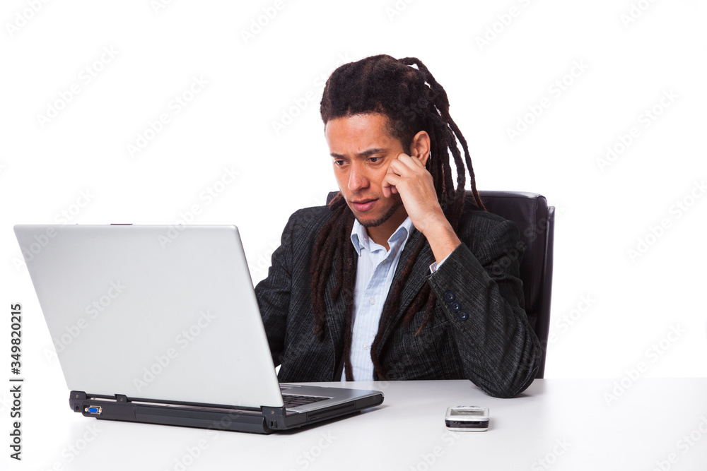 rastafari man working on the laptop rastafari man working on the laptop