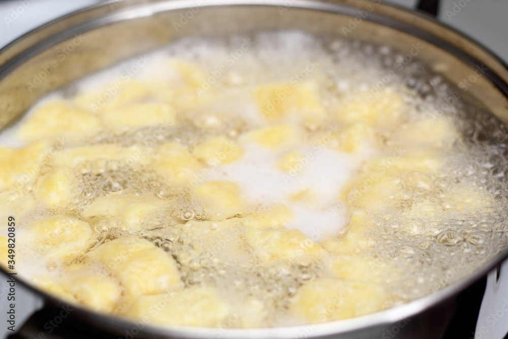 Gnocchi being prepared. Boiling. Dough dumplings with cheese. Gnocchi being prepared. Boiling. Dough dumplings with cheese.