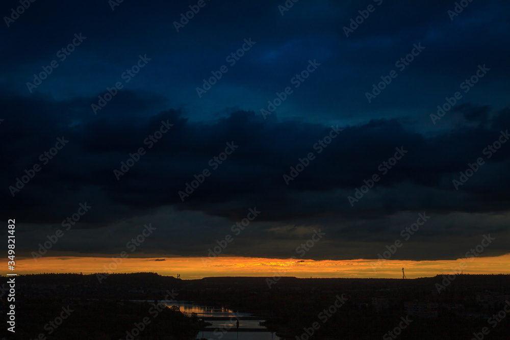 Fototapeta premium Sunset or sunrise over a river with a bridge