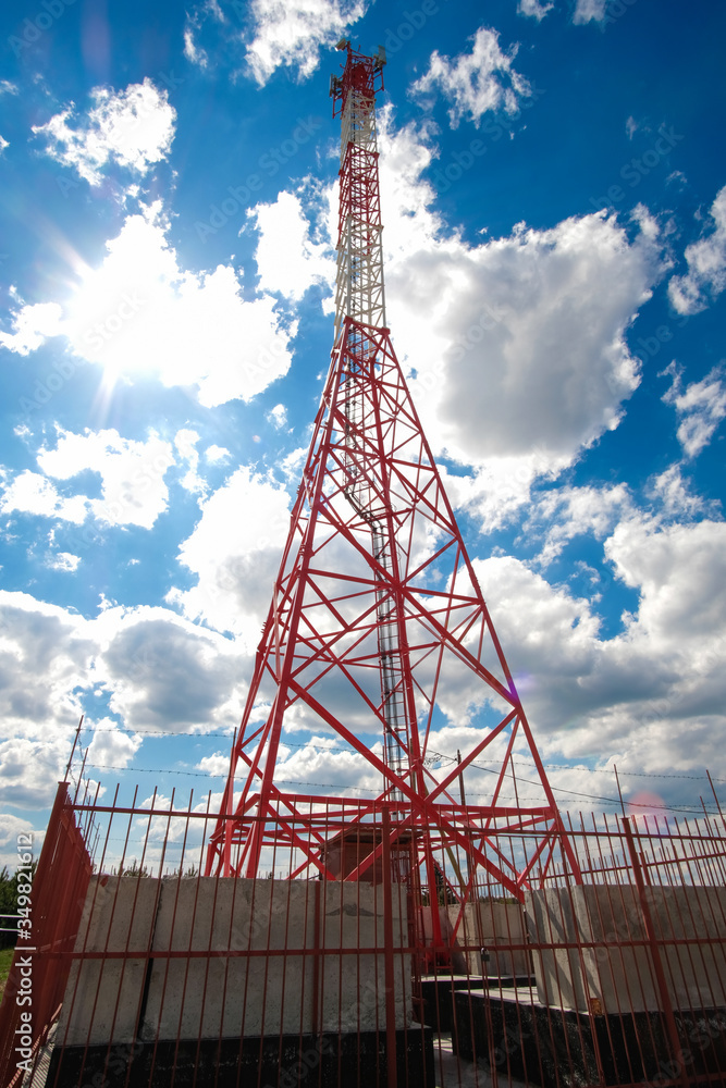 cell tower on a background of clouds and blue sky cell tower on a background of clouds and blue sky