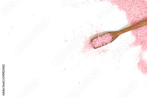 Pink salt isolated in scoop on white background. selective focus or blurry. photo