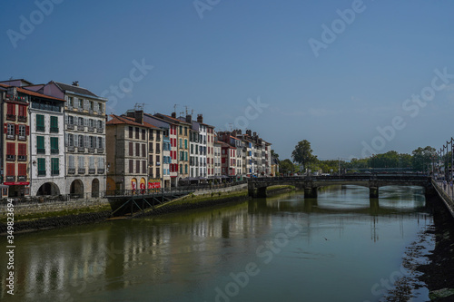 The city of Bayonne in France with buildings in the Nive River © VEOy.com